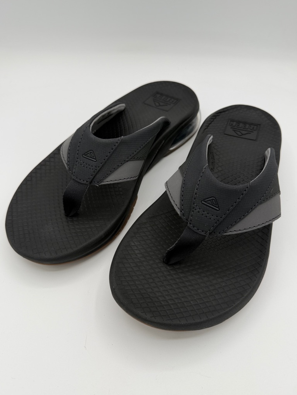 Reef Fanning +, black/gum